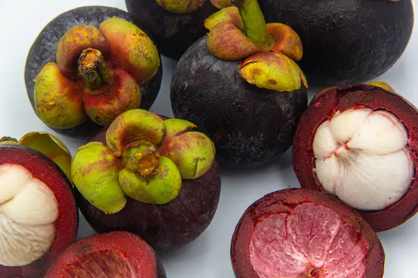 stock image Mangosteen fruits with cut isolated on white background