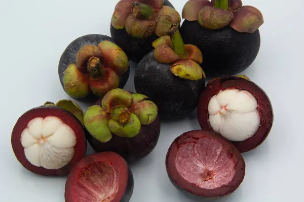 stock image Mangosteen fruits with cut isolated on white background