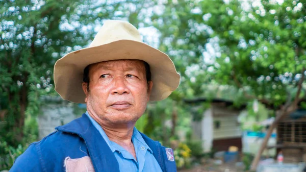 stock image Adult male worker, face, standing, close-up, healthy, wearing a big hat, 50-55 years old, Thai people