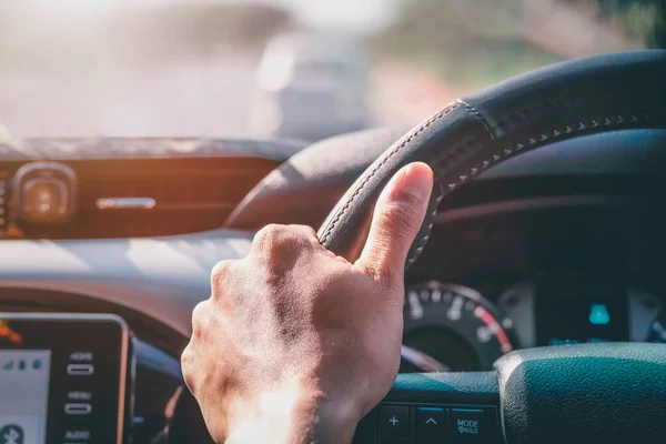 stock image Don't drive a careless concept. The hand is steering the car and driving consciously and not driving the car carelessly for the safety of life.