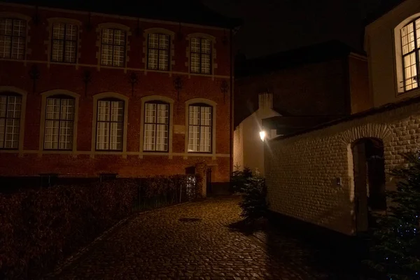 stock image Kortrijk, West Flanders, Belgium, 24.12.2023, old white beguinage building complex at night. High quality photo