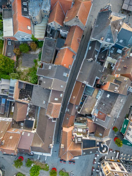 stock image Aerial top view of residential area houses roofs and streets from above, old town background, Belgium, Europe. High quality photo