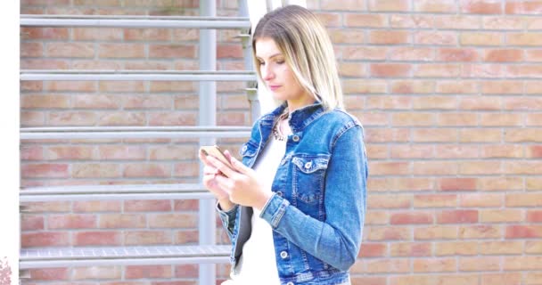Stock Footage Features Trendy Young Woman Denim Jacket Browsing Her — Stock Video