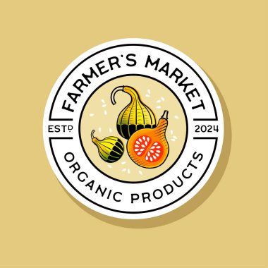 Çiftçi Market logosu. Harfler ve parlak balkabakları, yuvarlak bir rozette oyma tarzında.. 