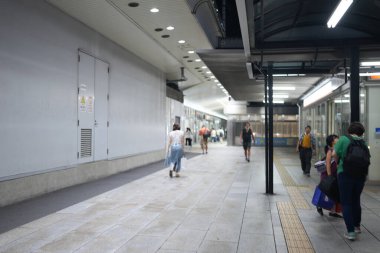 Crowded night scene in front of Nagoya Station in Nakamura Ward, Nagoya City, Aichi Prefecture, Japan, during Obon summer 2028. clipart