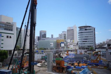 Scene of construction and crowd in front of Sannomiya Station in Sannomiya, Kobe City, Hyogo Prefecture, Japan, during Obon summer 2024. clipart