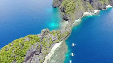 Filipinler 'in Palawan Adası' ndaki bir turizm merkezi olan El Nido 'nun gizli cennetinde Mayıs ayında yakalanan adaların, dağların ve plajların insansız hava aracı görüntüleri..