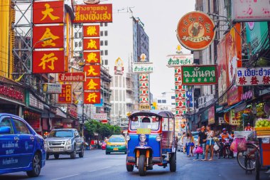 CHINATOWN, BANGKOK - 29 Dec: Tuk Tuk on in Yaowarat road, the main street of Chinatown in Bangkok on December 29, 2022. Chinatown is one of the famous landmark in Bangkok.