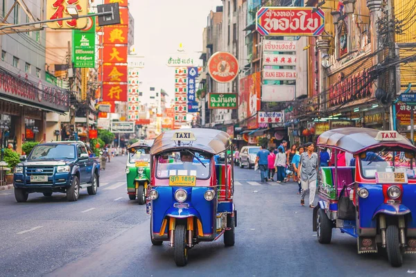CHINATOWN, BANGKOK - 29 Dec: Tuk Tuk on Yaowarat road, the main street of Chinatown in Bangkok on December 29, 2022. Chinatown is one of the famous landmark in Bangkok.