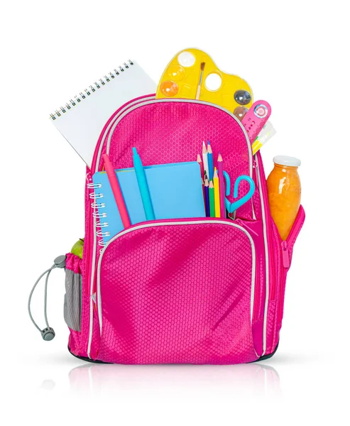 Pink backpack with school supplies isolated on white background.