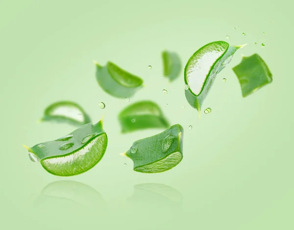 Aloe Vera Slices Flying Composition Green Background — Stock Photo, Image