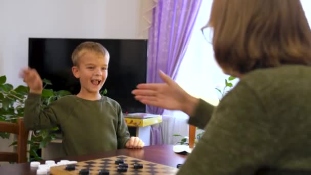 Little Boy Child Play Checkers Grandmother Boy Won Very Happy — Video