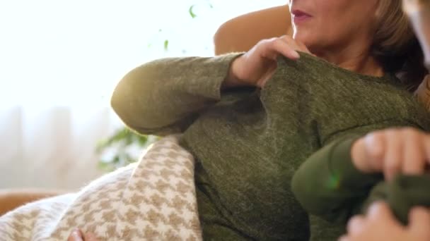 Grandmother Grandson Sitting Couch Taking Body Temperature High Quality Footage — Stockvideo