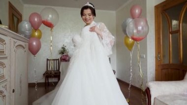 The bride tosses and dancing with her dress in slow motion shot. High quality FullHD footage