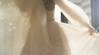 Woman with long hair dancing modern dance. Contemporary freestyle. Caucasian girl dancing in studio with large windows. Sexy girl dance and singing. High quality 4k footage