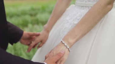 The guy gently takes the girls hand. Nice close-up. Very tender shots in slowmo. High quality FullHD footage