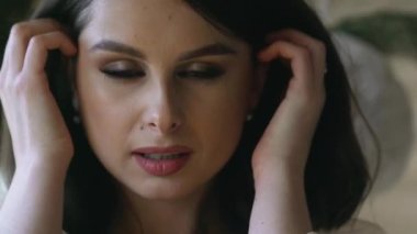 Gorgeous elegant fashion model with beautiful hair posing, yellow lights bokeh background. High quality 4k footage