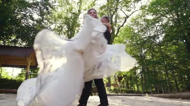 Groom Spinning Bride Holding Her His Arms Park Slow Motion — Stock video