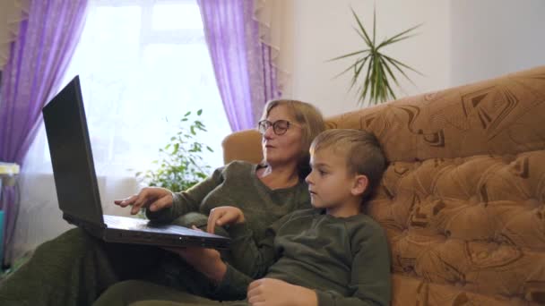 Elderly Woman Grandmother Teaching Her Grandson Write Words Laptop Keyboard – Stock-video