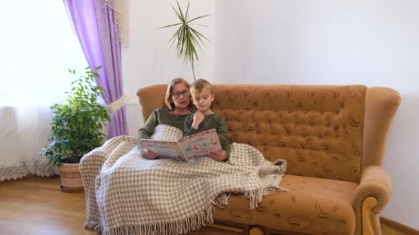 Little Grandson Tries Read Book Loving Grandma Home Toddler Boy — Stockvideo