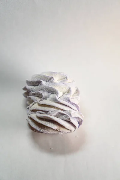 Homemade lavender marshmallows on white background. Russian lavender zephyr. Selective focus. Close up. High quality photo