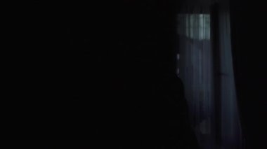 Silhouette wedding dress standing on mannequin in front of the window. High quality FullHD footage