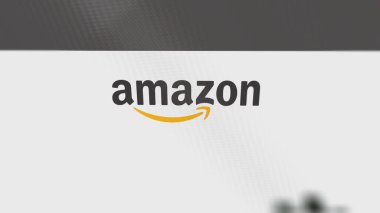 28th July 2023 Seattle, Washington. The logo of Amazon on a white wall of screens. Amazon brand on a device. clipart