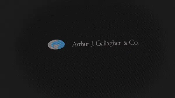 2023年9月7日伊利诺伊州滚滚草原 亚瑟J 加拉格尔公司的标志在屏幕的白色墙上 Arthur Gallagher Co品牌在设备上 — 图库照片