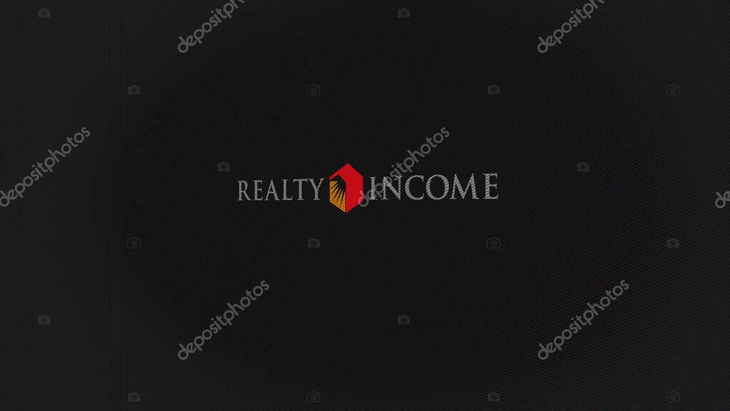 07th September 2023 San Diego, California. The logo of Realty Income on a white wall of screens. Realty Income brand on a device.