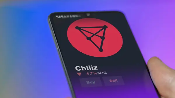 stock image September 19th 2023. An investor analyzing the price of chiliz, the crypto $CHZ broke out above the limit, CHZ and climbs above the price.
