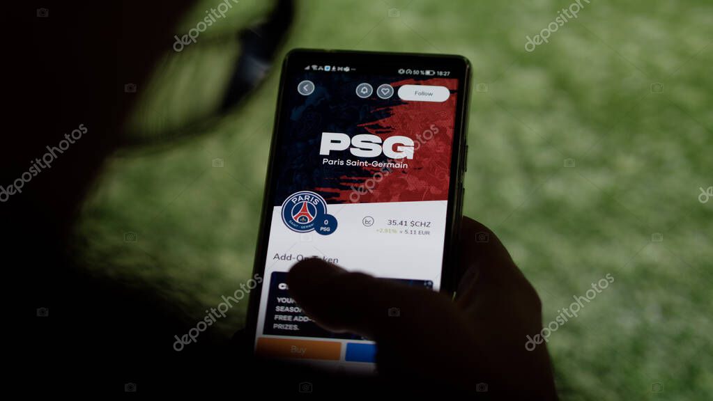 A fan looks at his team's Paris football fan token asset on Socios app. The price of the PSG nfts coin $PSG $CHZ on a screen, team token asset.