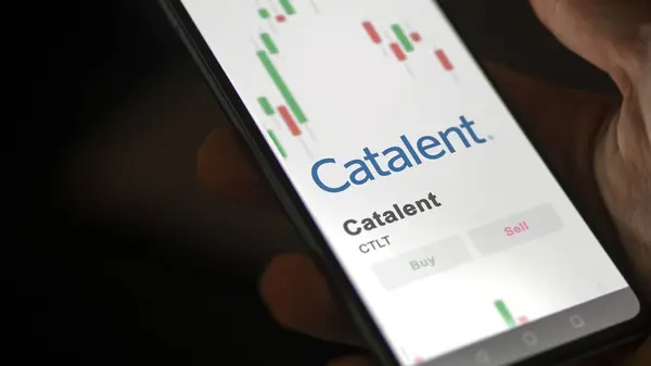 stock image The logo of Catalent on the screen of an exchange. Catalent price stocks, $CTLT on a device.