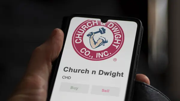 stock image The logo of Church & Dwight on the screen of an exchange. Church & Dwight price stocks, $CHD on a device.