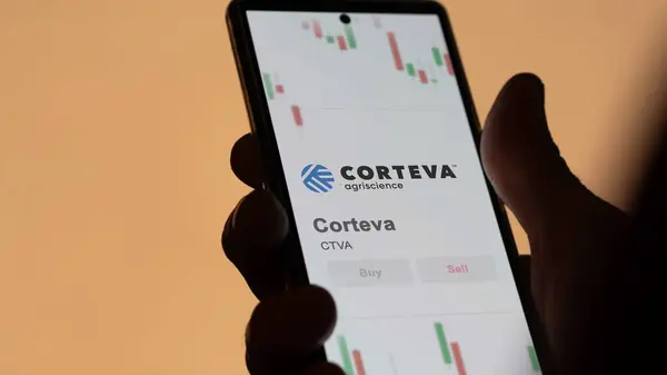 stock image The logo of Corteva on the screen of an exchange. Corteva price stocks, $CTVA on a device.