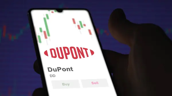 stock image The logo of DuPont on the screen of an exchange. DuPont price stocks, $DD on a device.