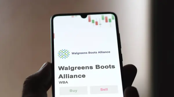 stock image The logo of Walgreens Boots Alliance on the screen of an exchange. Walgreens Boots Alliance price stocks, $WBA on a device.