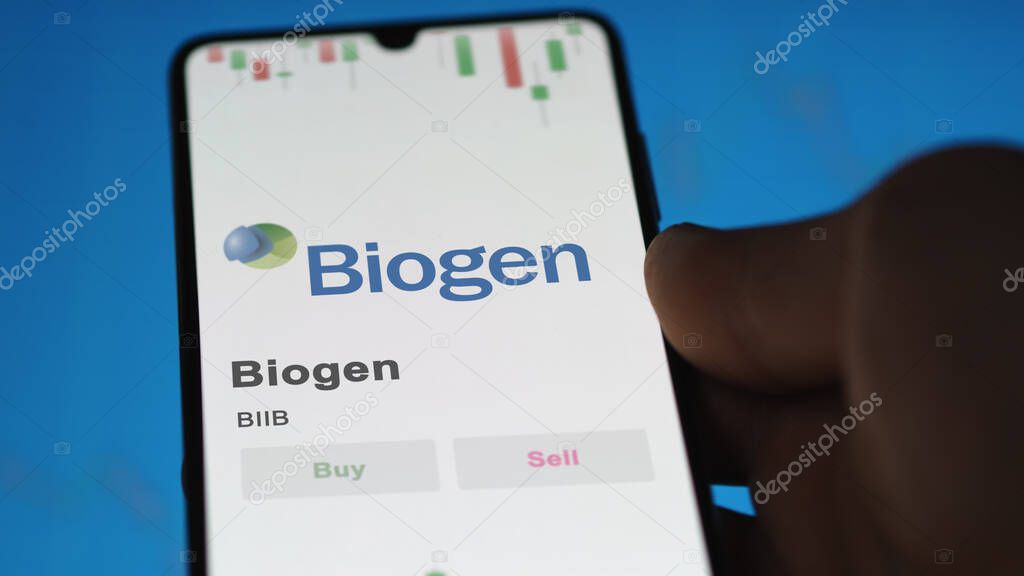The logo of Biogen on the screen of an exchange. Biogen price stocks, $BIIB on a device.