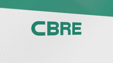 Beyaz ekran duvarında CBRE Grubu 'nun logosu. Bir aygıt üzerinde CBRE Grup damgası.