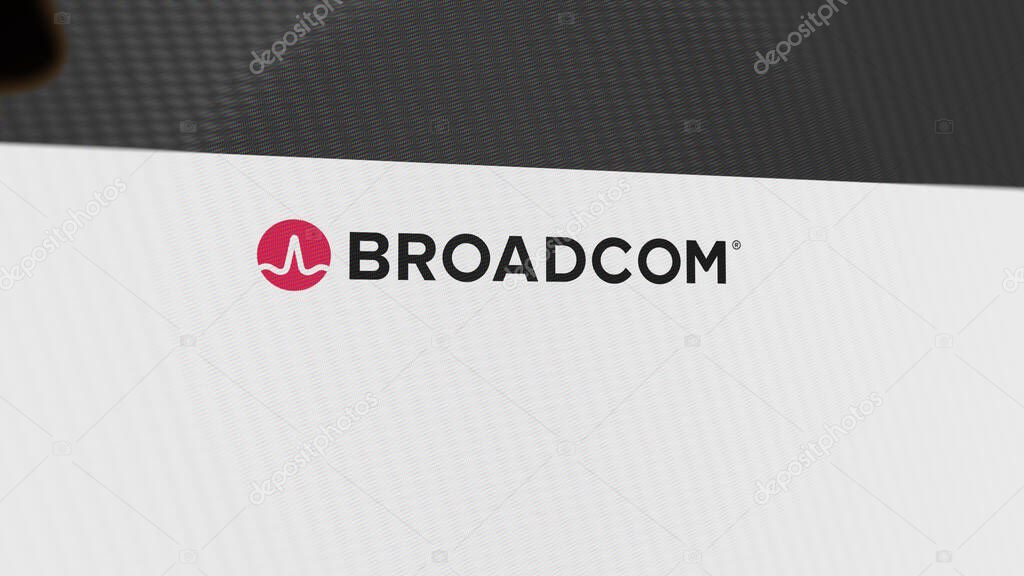 The logo of Broadcom Inc. on a white wall of screens. Broadcom Inc  brand on a device.