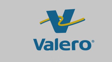 Beyaz ekran duvarında Valero Enerji logosu. Valero Enerji damgası bir aygıt üzerinde.