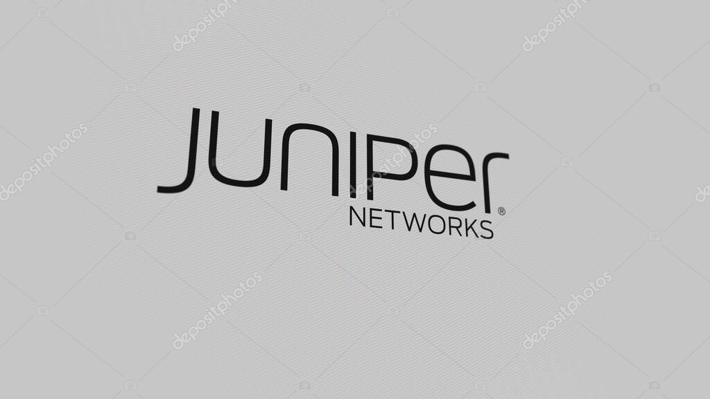 The logo of Juniper Networks on a white wall of screens. Juniper Networks brand on a device.