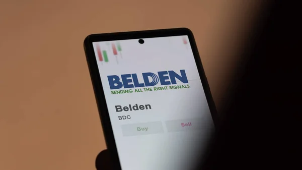 stock image The logo of Belden on the screen of an exchange. Belden price stocks, $BSC on a device.