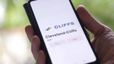 The trading page of Cleveland-Cliffs on a stock exchange, a shareholder analyzing $CLF, Cleveland-Cliffs, on a device. clipart