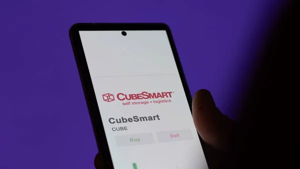 Stock image The trading page of CubeSmart on a stock exchange, a shareholder analyzing $CUBE, Cube Smart, on a device.