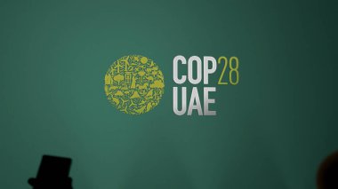 The logo of the COP28 UAE on a green wall. The COP's logo of 2023 color logo, cop 28.