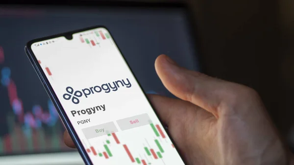 stock image November 20th 2023. The logo of Progyny on a giant white screen, the brand  on a device.