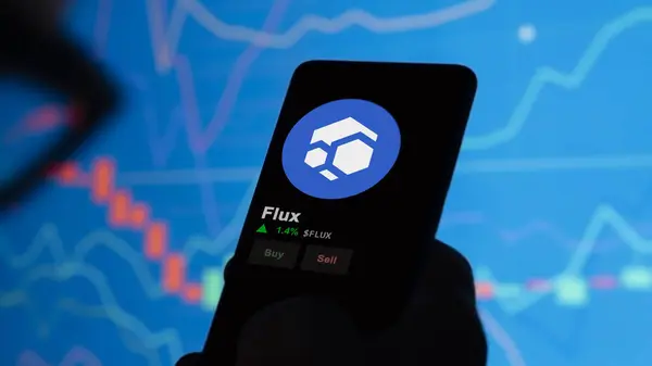 stock image November 24th 2023. An investor analyzing the price of Flux on a phone, the token coin $FLUX on a crypto exchange sreen.