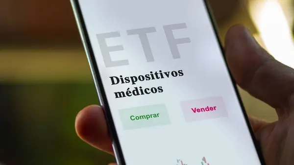 An investor analyzing an etf fund. ETF text in Spanish : medical devices, buy, sell.
