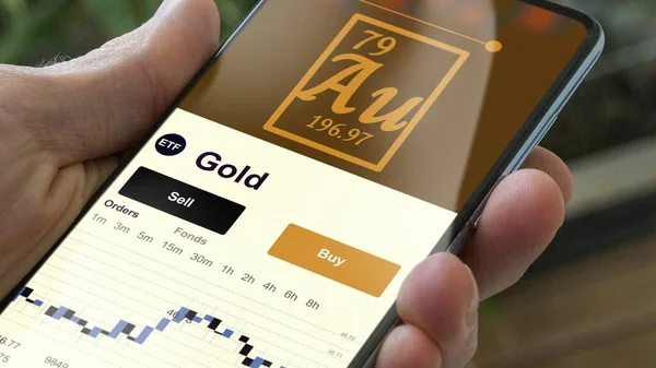 Exchange-traded fund chart, invest in stock market data on smartphone of gold. Business analysis of a trend. Investing in international funds. Buying blue chips precious metal strategic ETF