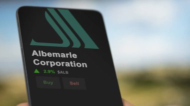 Albemarle Corporation on the screen of an exchange. Albemarle Corporation price stocks, $ALB on a device.